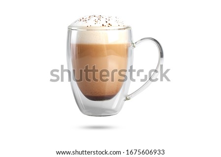  cappuccino with cinnamon on a foam in a transparent cup with a double bottom. isolate on white background Royalty-Free Stock Photo #1675606933