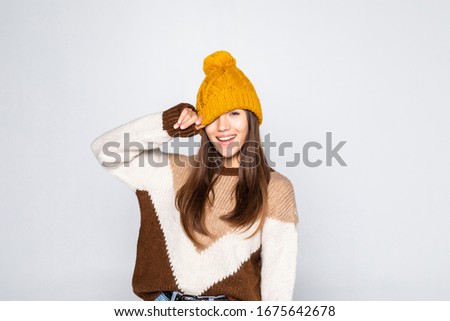 Beautiful woman winter portrait. Smiling girl wearing warm clothes having fun