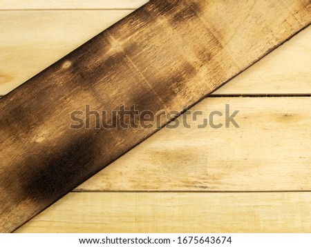 Background of horizontal and cross-fired wooden boards