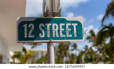 Green sign with street name
