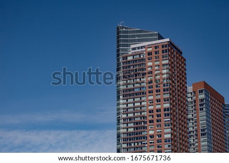 Buildings in New York City with a clear blue sky in the background 