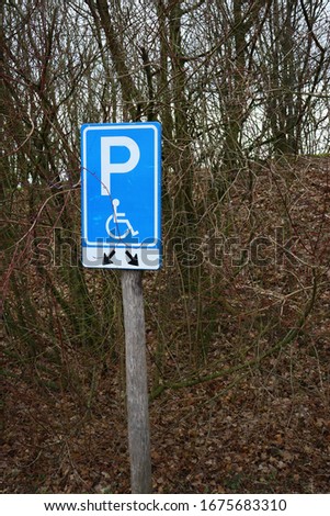 A vertical shot of a handicap parking sign