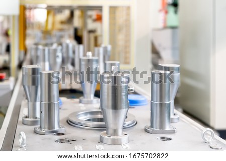 The steel cylindrical parts are on the machine platform