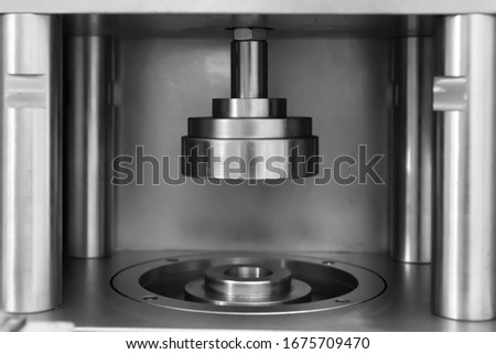 Close-up of the pressure equipment on the production line Royalty-Free Stock Photo #1675709470