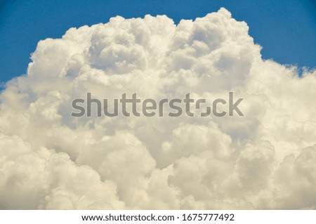 White fluffy clouds in blue sky, a sense of freedom