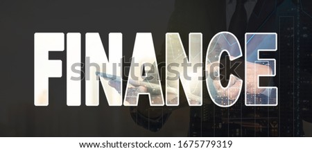 Finance Text marking of Double exposure of businessman using the tablet with cityscape and financial graph on blurred building background, Business Trading and finance, multi exposure concept