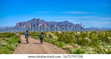 Bike riding toward the Superstition Mountains in Mesa Arizona 