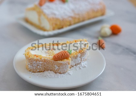 home made Easter sponge roll with carrots on a table
