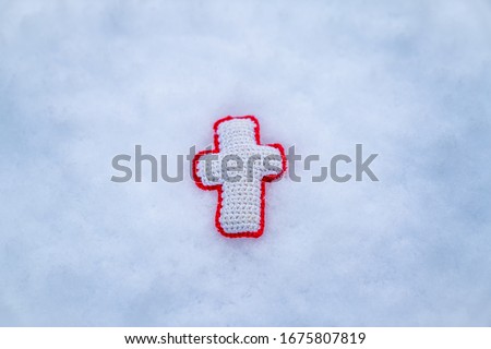 This is a picture of the cross in the snow.