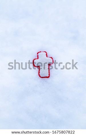 This is a picture of the cross in the snow.
