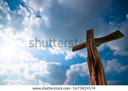 This is a picture of a cross taken with a sky view.