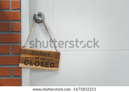 close signboard hanging at the door