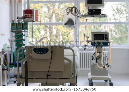 Intensive care unit in hospital, bed with monitor, ventilator, a place where they are treated patients with pneumonia caused by coronavirus covid 19. Royalty-Free Stock Photo #1675846960