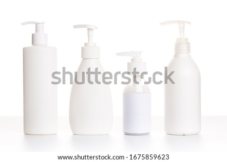 detergent bottles and chemical cleaning supplies isolated on white