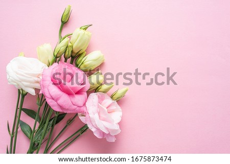 Bunch of beautiful eustoma flowers on pink background	 Royalty-Free Stock Photo #1675873474