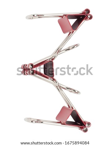 Cyrillic letter Ze red binder clips alphabet. Office metal foldback braces. Metal binder clips isolated on white background