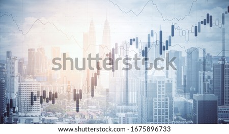 Glowing stock analytics on blurry city background. Trade and investment concept. Multiexposure