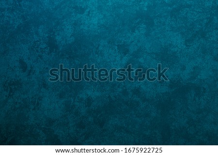 Texture of stucco painted in a heterogeneous turquoise color Royalty-Free Stock Photo #1675922725