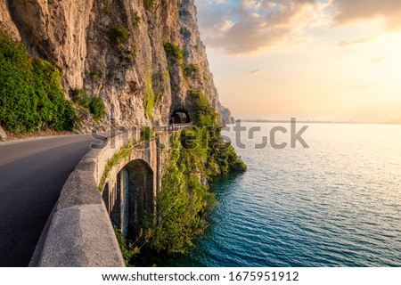 The Garda Lake coastal road near Limone del Garda, Brescia Province, Lombardy, Italy,  Royalty-Free Stock Photo #1675951912