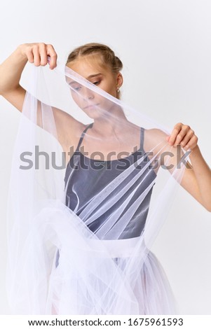 ballerina in a black swimsuit isolated background