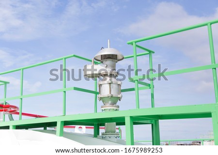 Safety valves for releasing air pressure inside the chemical tank
 installed on the roof. Royalty-Free Stock Photo #1675989253