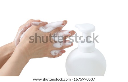 Woman washing hands with foam, white plastic pump container to prevent virus on white background