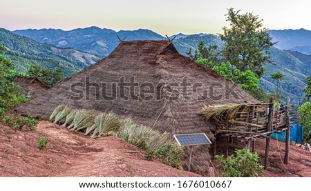 Hill tribe village thatched with roof grass In Thailand