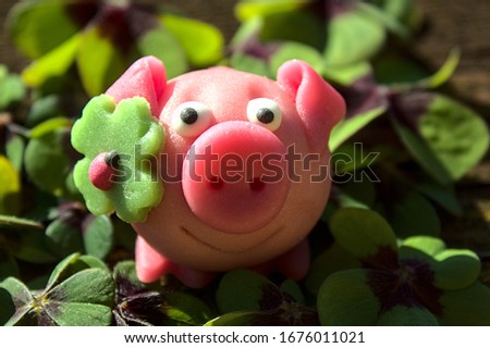 marzipan pig in lucky clover Royalty-Free Stock Photo #1676011021