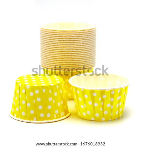 Paper colored in white peas capsule for a cupcake on a white background