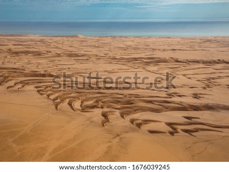 Aerial picture of the landscape of the Namib Desert and the Atlantic Ocean on the Skeleton Coast in western Namibia during summer