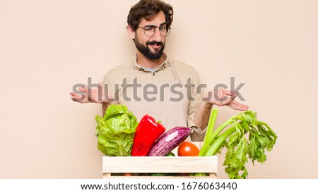 green grocery man feeling clueless and confused, not sure which choice or option to pick, wondering