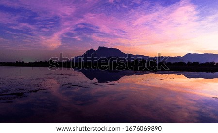 Great view of the lake under a purple sky, Mountain lake in Thailand. Dramatic unusual scene