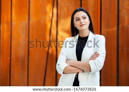 Portrait Of Successful Business Woman. Active lifestyle. Modern business girl outside. Female Leader. Beautiful Russian girl. Success concept.