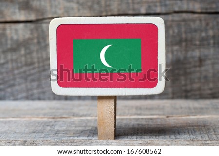 Maldives Flag on Small wooden framed blackboard on wooden background