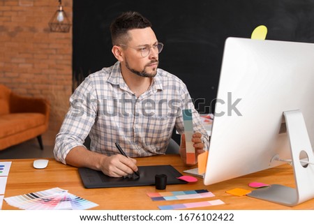 Male designer working in office