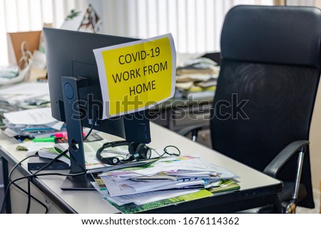 Empty office space while officer is working from home to avoid corona virus. Worker follows social distancing and stays at home to prevent COVID-19 or 2019-nCoV infection and reduce pandemic. Royalty-Free Stock Photo #1676114362