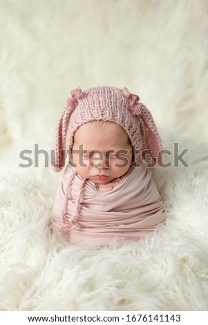 
Newborn sleeping wrapped in a cocoon. 
Newborn cocoon. 
Newborn Cocoon Sleeps on Llama Fur
