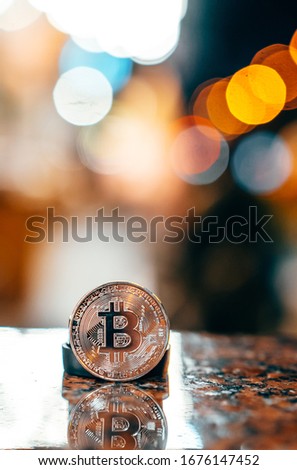 Silver bitcoin isolated on the table, glowing background