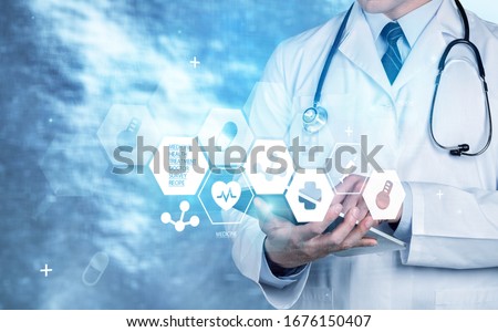 Medical doctor with digital tablet, medical network concept