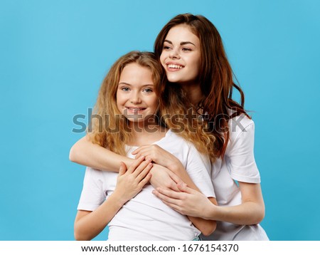 Mom and daughter family hug lifestyle