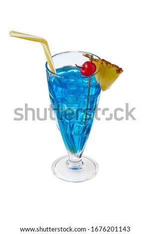 Blue Lagoon cocktail with ice cubes is contained in milkshake glass with pineapple slice on the rim, a straw and a cherry on the stick. The showy illustrative picture is made on the white background.