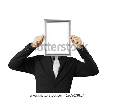 businessman looking through an empty picture frame 