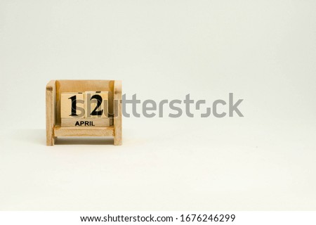12 April Easter Day Wooden Calendar in White Background with Place for Text on Right Side