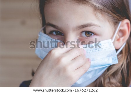 Portrait of a girl in a medical mask