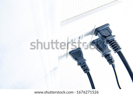 Photo of outlet plug in room.