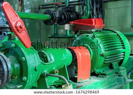 Electric feed pump for supplying water to a gas boiler house. Gas boiler house equipment. Royalty-Free Stock Photo #1676298469