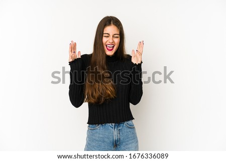 Young caucasian woman isolated on white background laughs out loudly keeping hand on chest.