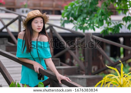 Portrait of beautiful asian chic girl pose for take a picture,Lifestyle of teen thailand people,Modern woman happy concept,Traveler walking on weekends.