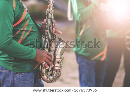 Musical instruments,Saxophone Player hands Saxophonist playing jazz music. Alto sax musical instrument closeup Royalty-Free Stock Photo #1676393935