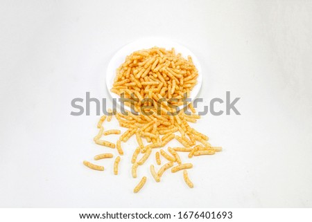 Fried and Spicy Stick, Sali Sev, noodles, Snacks or Fryums (Snacks Pellets) fryums Royalty-Free Stock Photo #1676401693